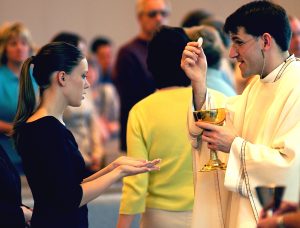 Girl receiving Eucharist
